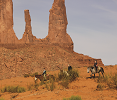 Monument Valley buttes and people on horses